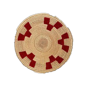 Handwoven round bowl basket with red block motifs, natural African grasses